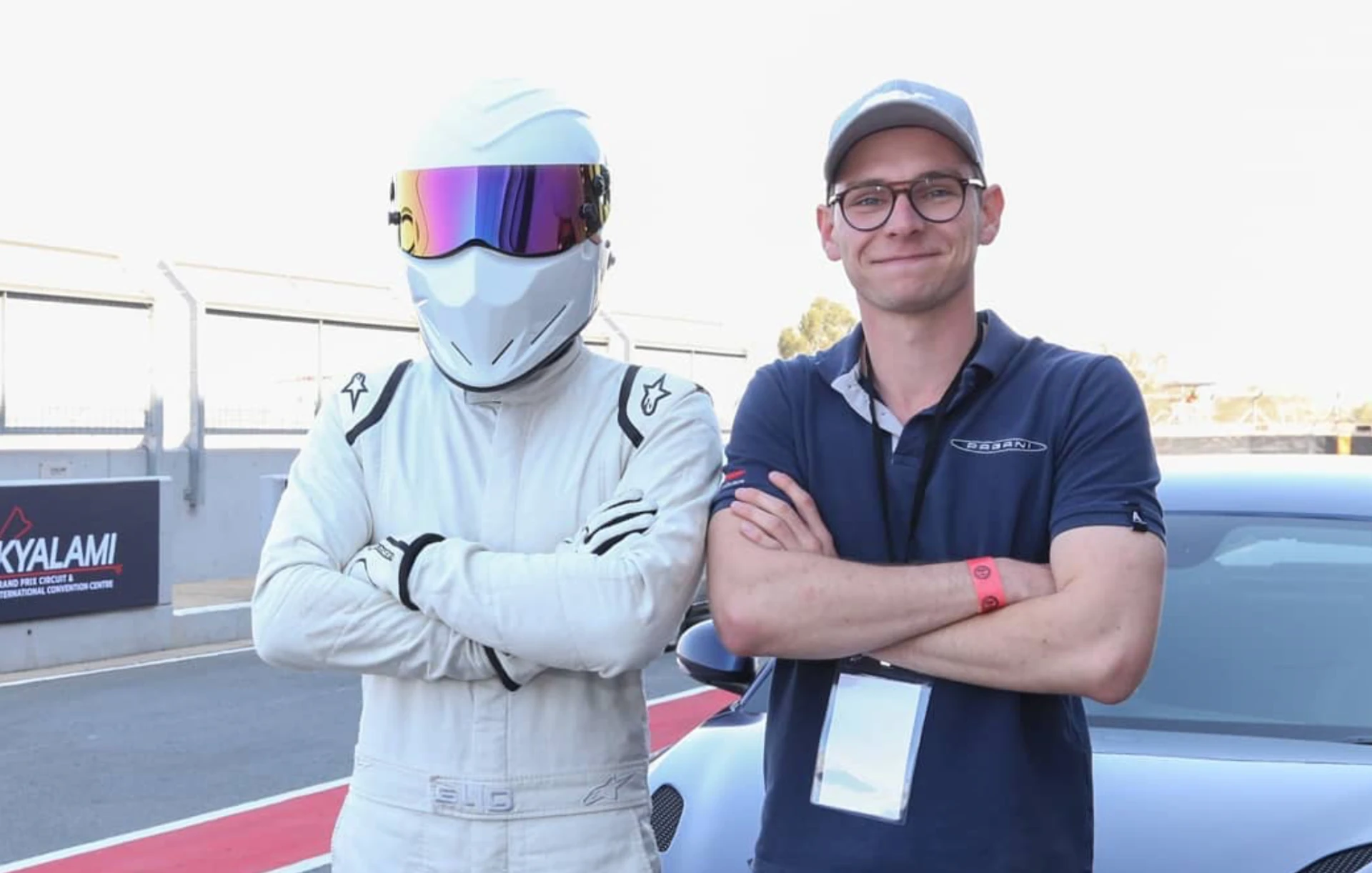 John Whittle standing beside The Stig in the Kyalami pit lane with a Pagani behind them