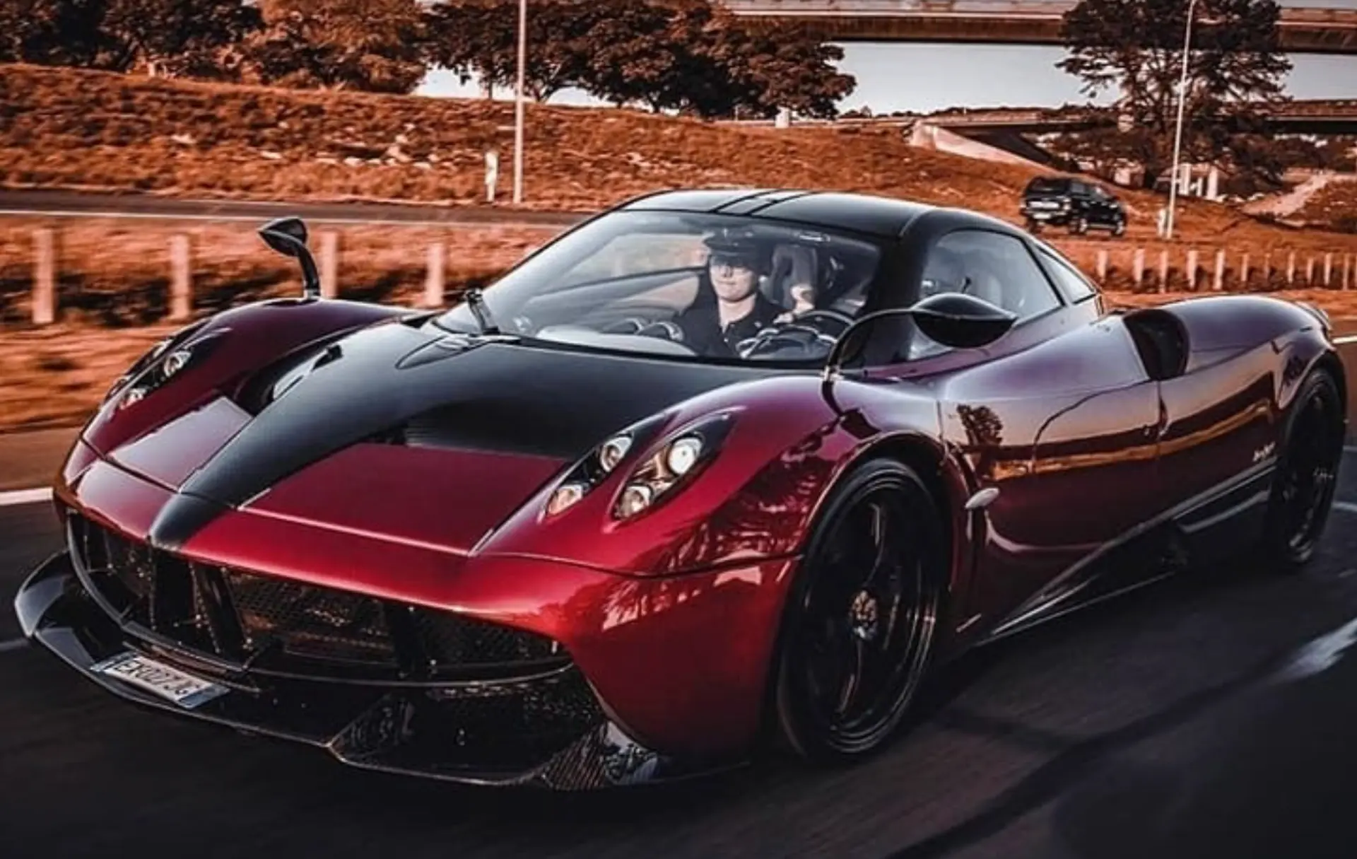 Deep red Pagani Huayra prototype photographed in motion on a Johannesburg road