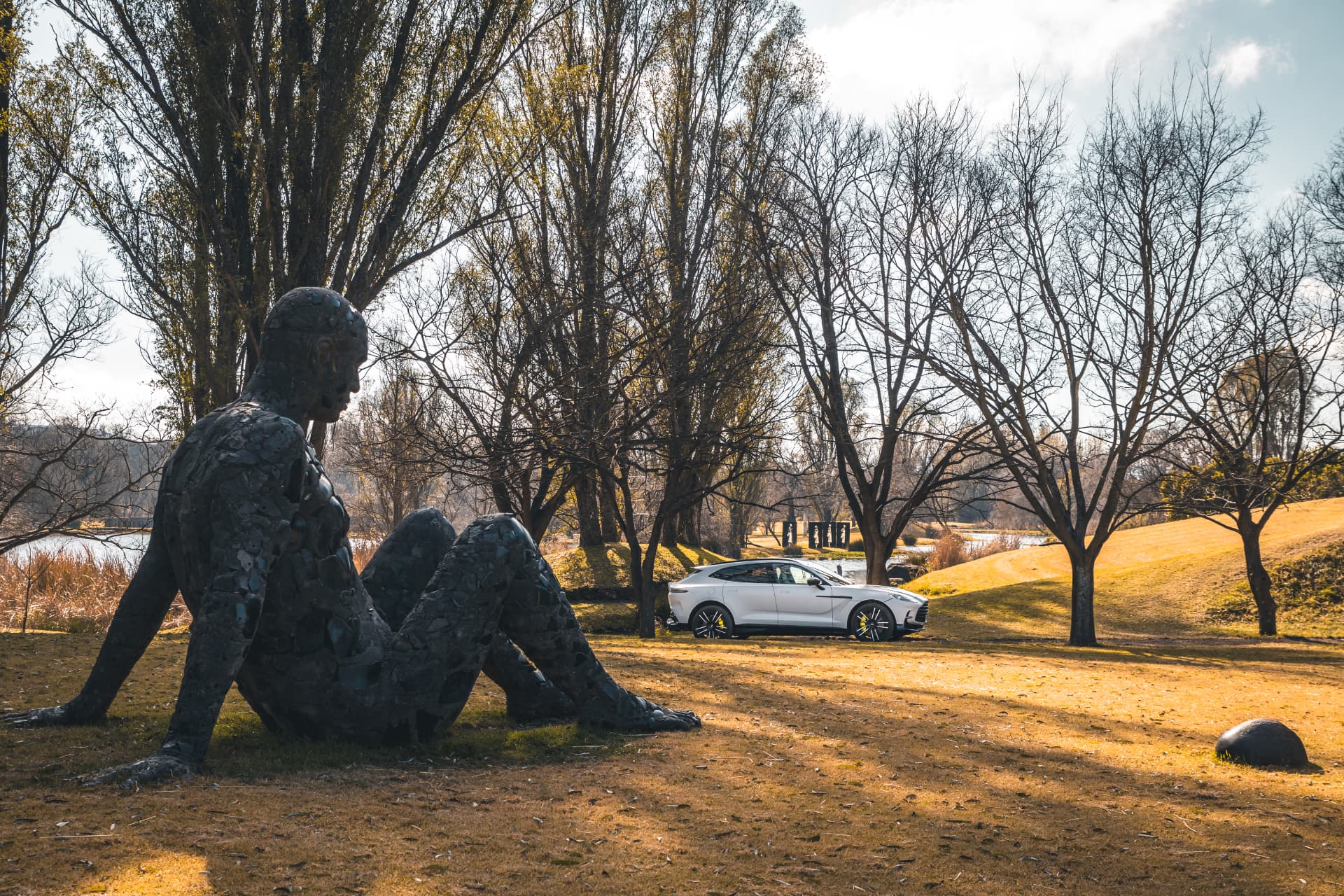 White DBX707 parked among the sculptures at Nirox Sculpture Park