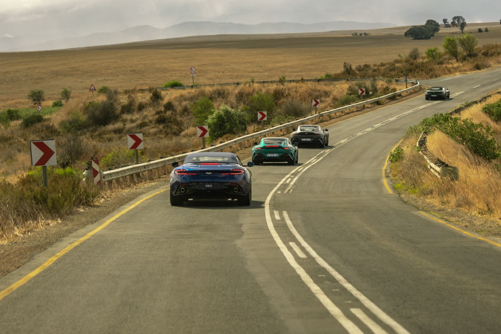 Breakfast run convoy winding through the wheat fields of the Western Cape